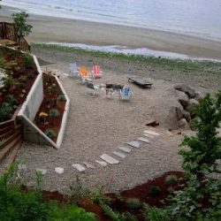 Beach level preserves natural bank and provides access to the water.